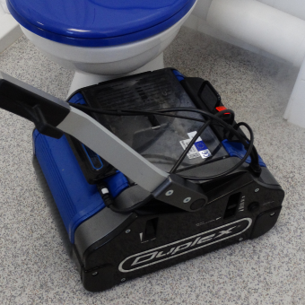 Duplex cleaning machine used for bathroom floor cleaning.