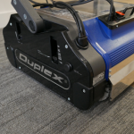 Duplex Professional Commercial Floor Scrubber is cleaning the carpet.