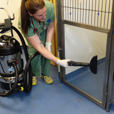 Image depicting the use of Duplex Steam Cleaning Systems for effective and comprehensive sanitation of animal cages in care facilities.