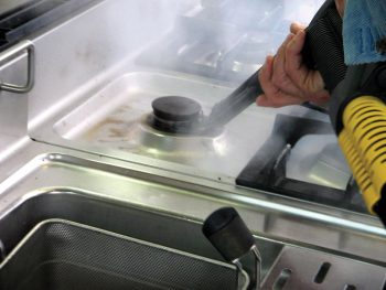 Image showcasing Duplex's steam cleaning technology for ovens and stoves in cafes, effectively eliminating grease and food residues.