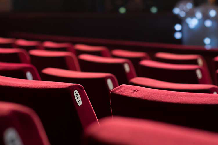 Image illustrating Duplex Cleaning Machines' methods for deep sanitisation and disinfection of upholstered surfaces in cinema and theatre settings.