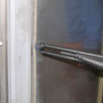 Image showing the use of Duplex steam cleaning machines for effectively degreasing and sanitising commercial fridges in kitchens.