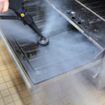 Image showing the Duplex steam cleaning machines effectively degreasing and sanitising commercial ovens.