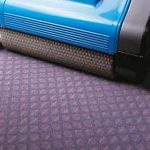 Image showcasing a Duplex Cleaning Machine cleaning a Flotex floor.