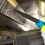 Image depicting the use of Duplex steam cleaning machines for effective degreasing and sanitising of kitchen canopies.