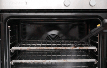 The Duplex JetSteam steam cleaner effectively removing grease and baked-on food from an oven.