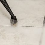 An image showing Duplex's steam cleaning machines effectively cleansing and rejuvenating grout lines in a bathroom.