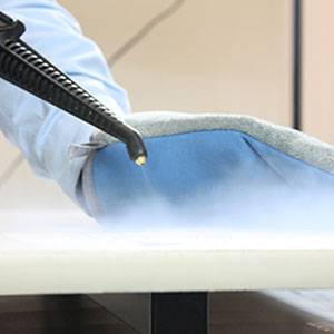 Duplex steam cleaner being used in a healthcare setting to prevent gastro outbreaks by thoroughly sanitising surfaces.