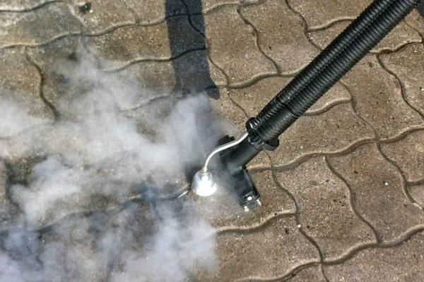 Image demonstrating the use of Duplex Cleaning Machines' steam cleaner for removing chewing gum from surfaces.
