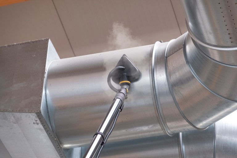 Image of the Tess High Ceiling Vacuum Cleaner performing cleaning and disinfection on high ceilings.