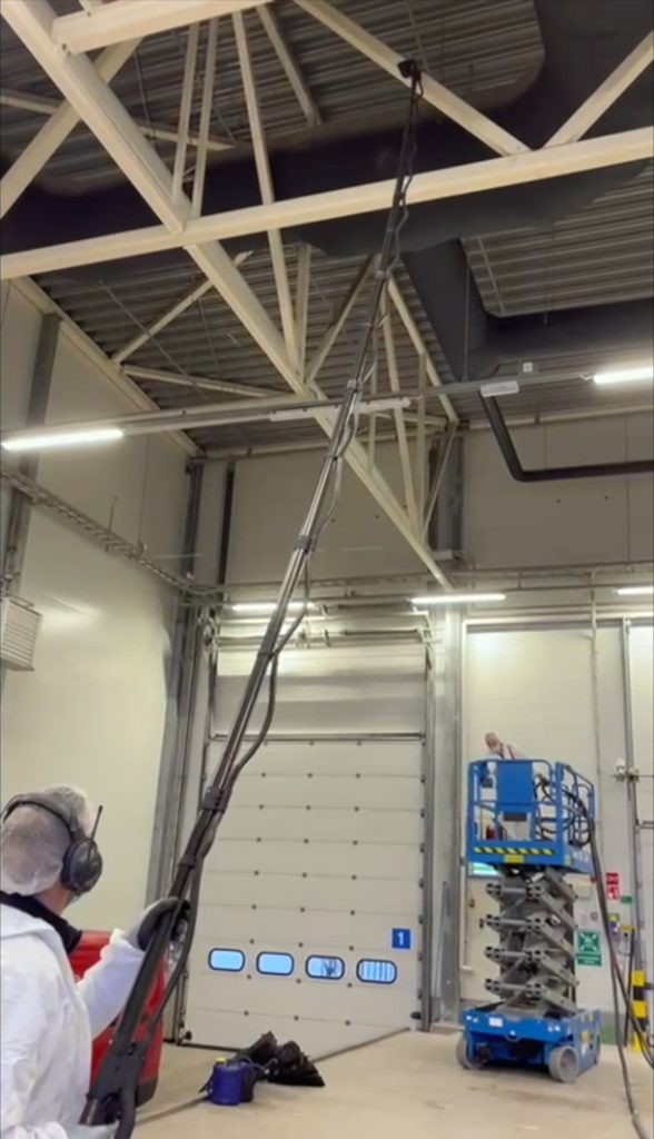 Image of the Tess High Ceiling Vacuum Cleaner demonstrating its versatile cleaning capabilities in various settings.