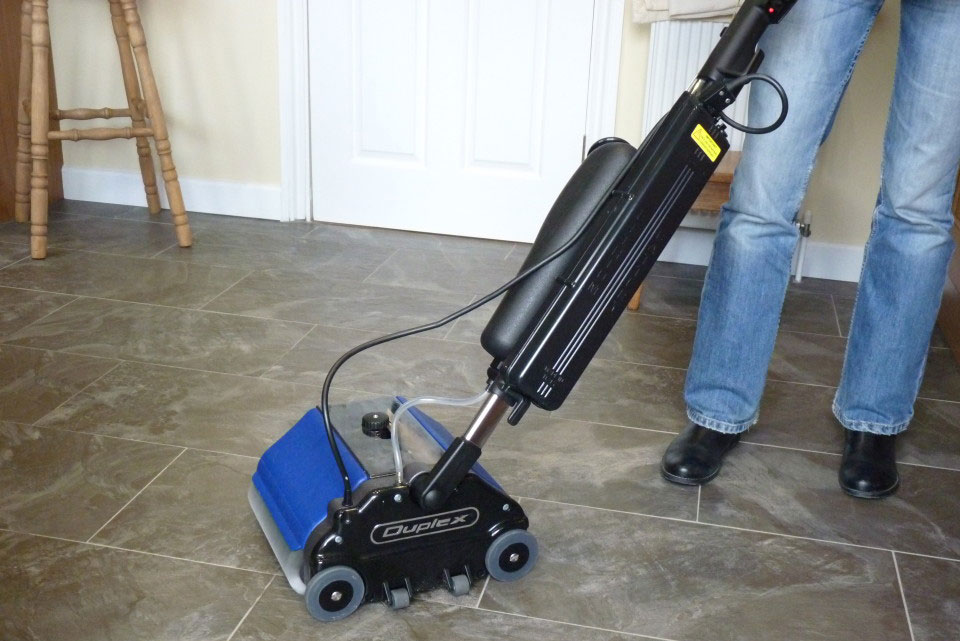 Duplex Lithium machine cleaning a hard tile floor
