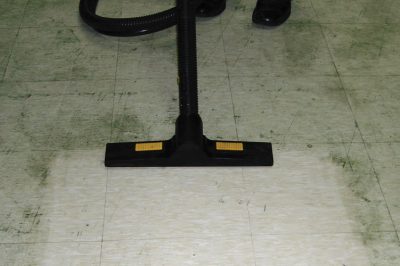 Duplex Vac 14 commercial vacuum effectively cleaning a hard floor surface, suitable for professional cleaning tasks.