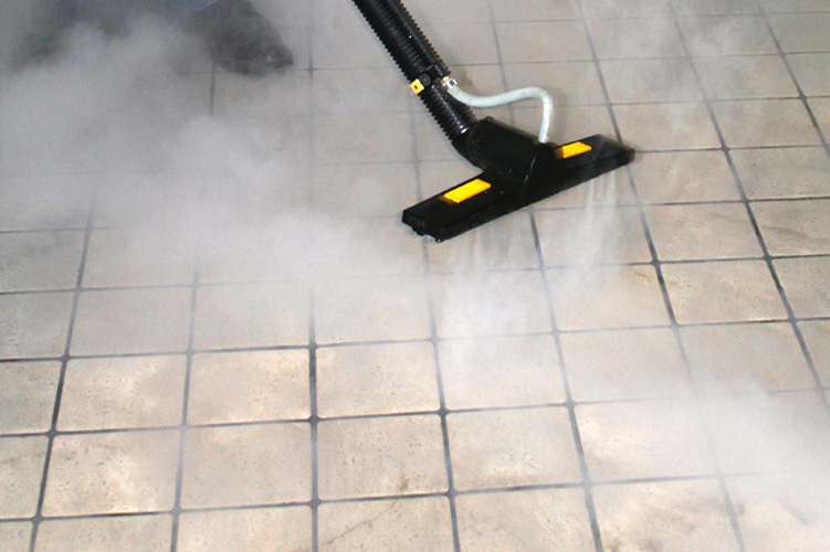 Jevac Steam vacuum cleaning machine is cleaning the tile
