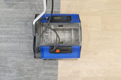 Duplex machine cleaning transition area between carpet and hard floor surface.